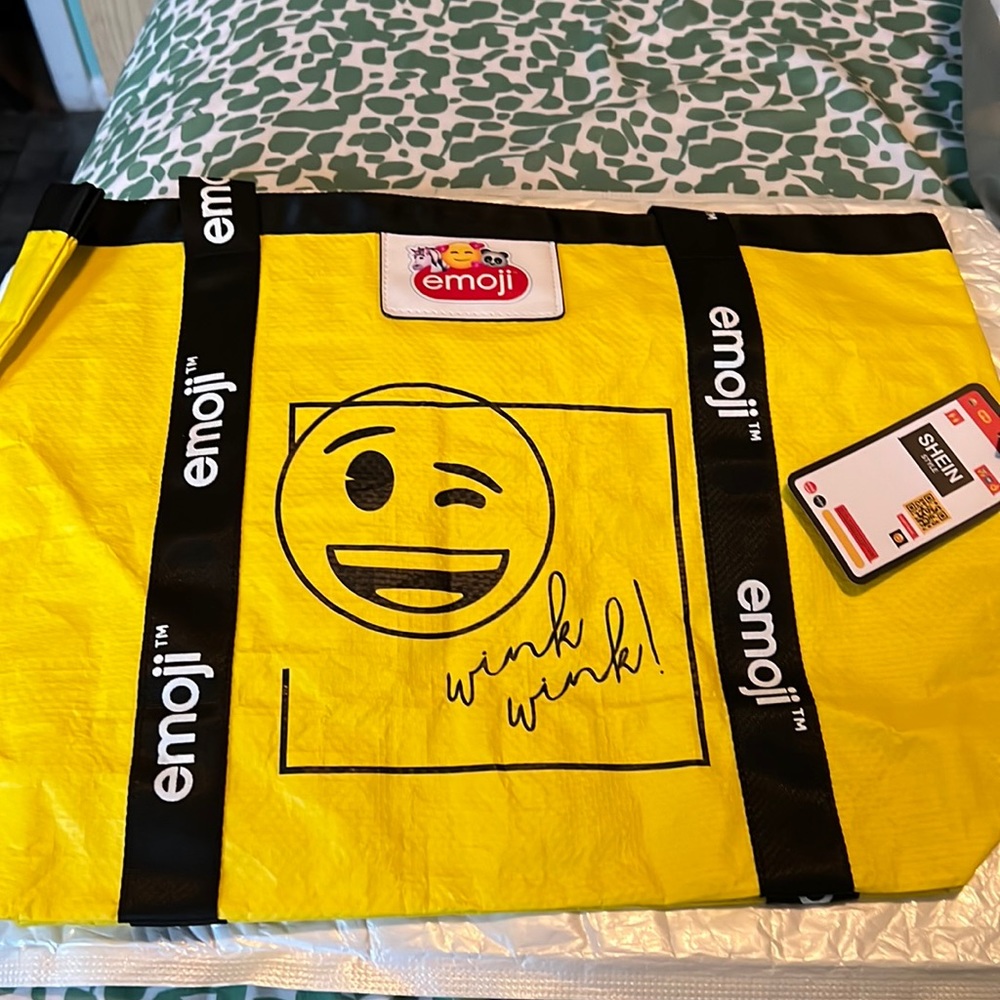 Women yellow bag emoji